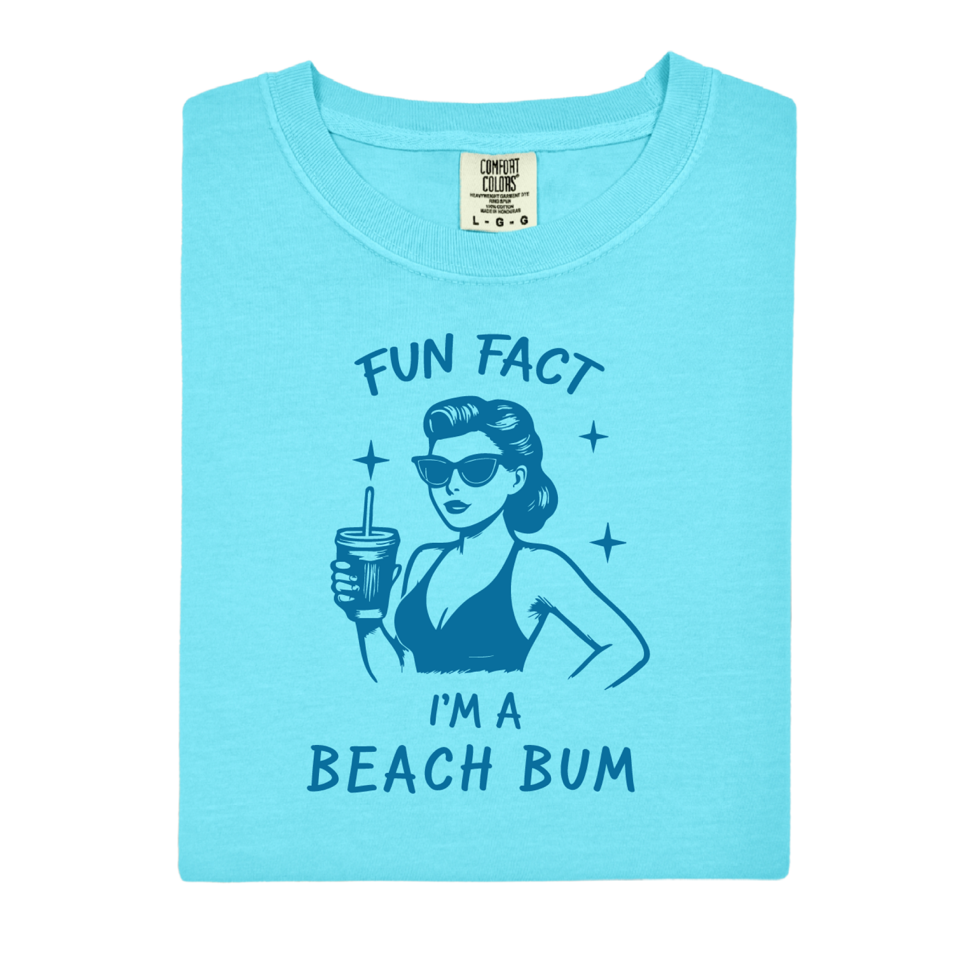 Light blue t-shirt with a graphic of a woman at the beach and text 'Fun Fact I'm a Beach Bum' on a white background.