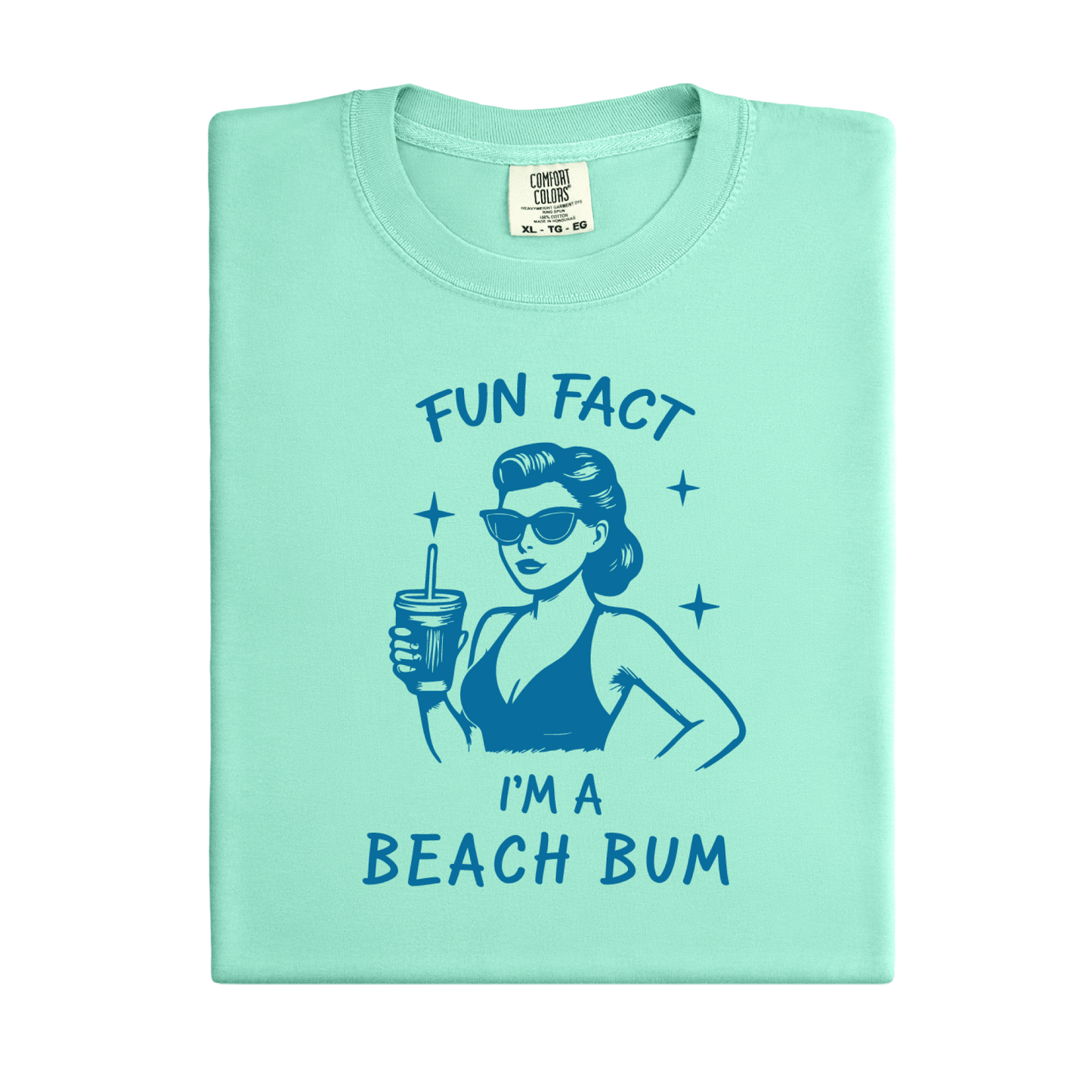Light green t-shirt with a graphic of a woman in a bikini and sunglasses, holding a drink, with text 'Fun Fact I'm a Beach Bum' on a white background.