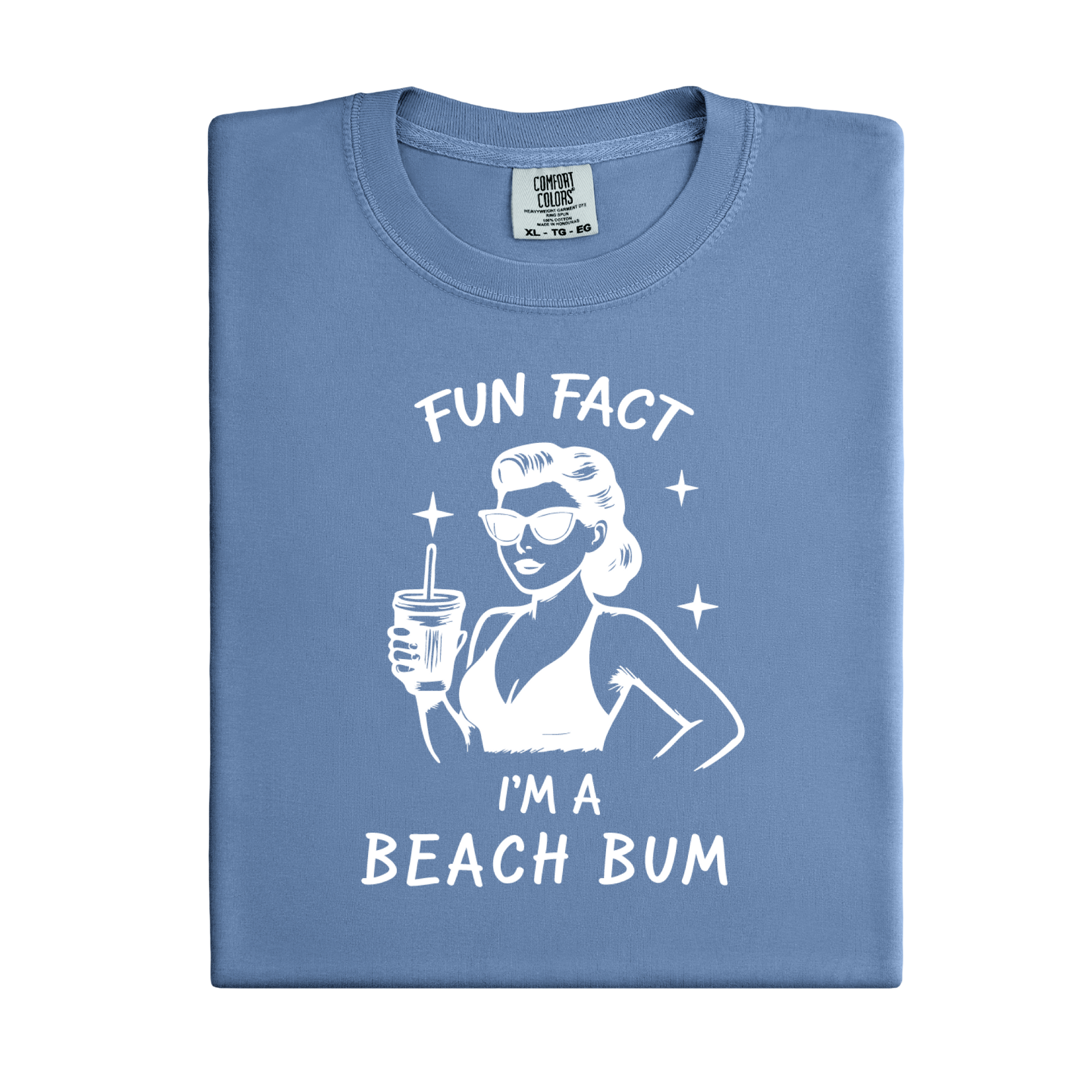 Folded blue t-shirt with a graphic of a woman at the beach and text 'Fun Fact I'm a Beach Bum' on a white background.