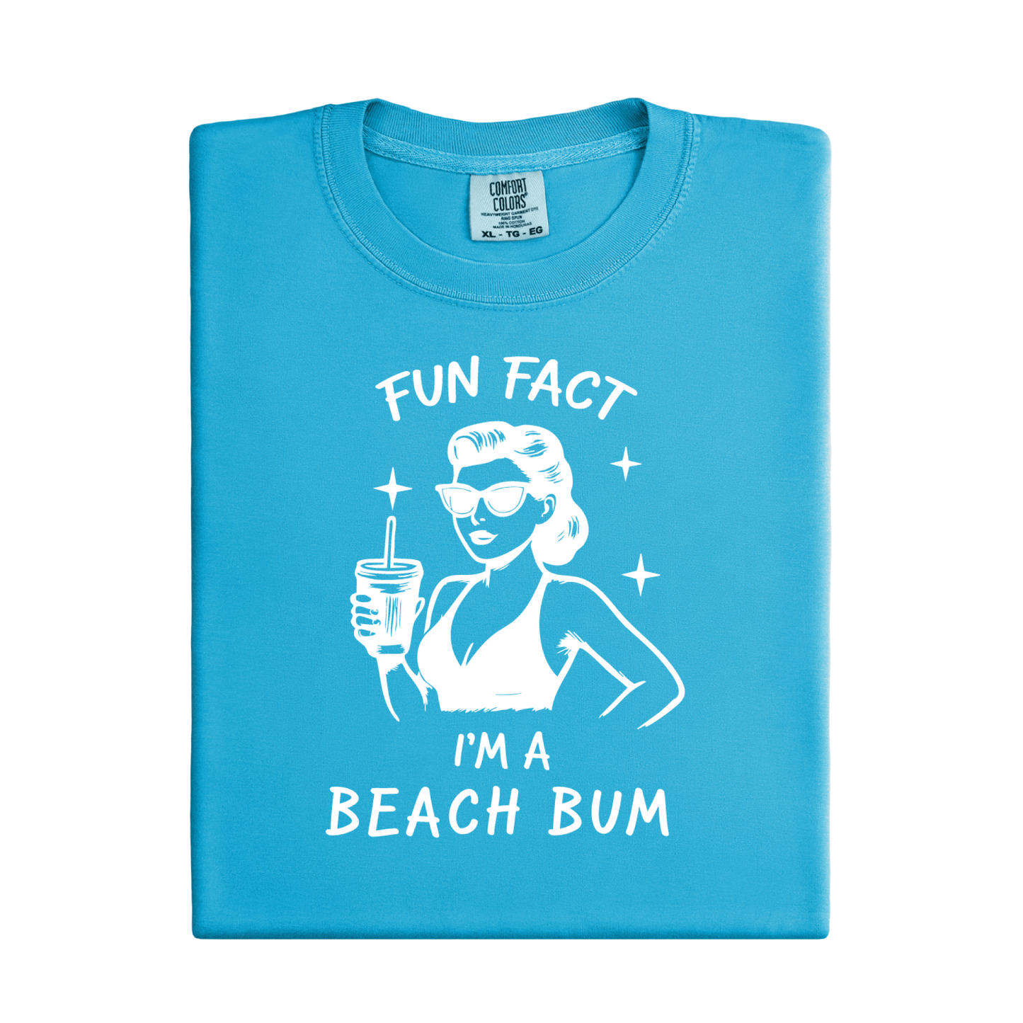 Blue t-shirt with a graphic of a woman at the beach and text 'Fun Fact I'm a Beach Bum' on a white background.