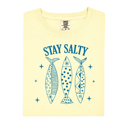 Yellow t-shirt with 'Stay Salty' text and fish illustrations on a white background