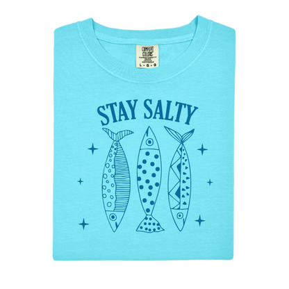 Light blue t-shirt with 'Stay Salty' text and fish illustrations on a white background