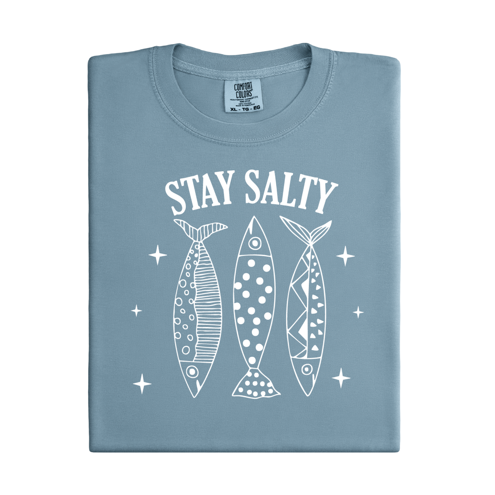 Folded blue t-shirt with 'Stay Salty' text and fish illustrations on a white background