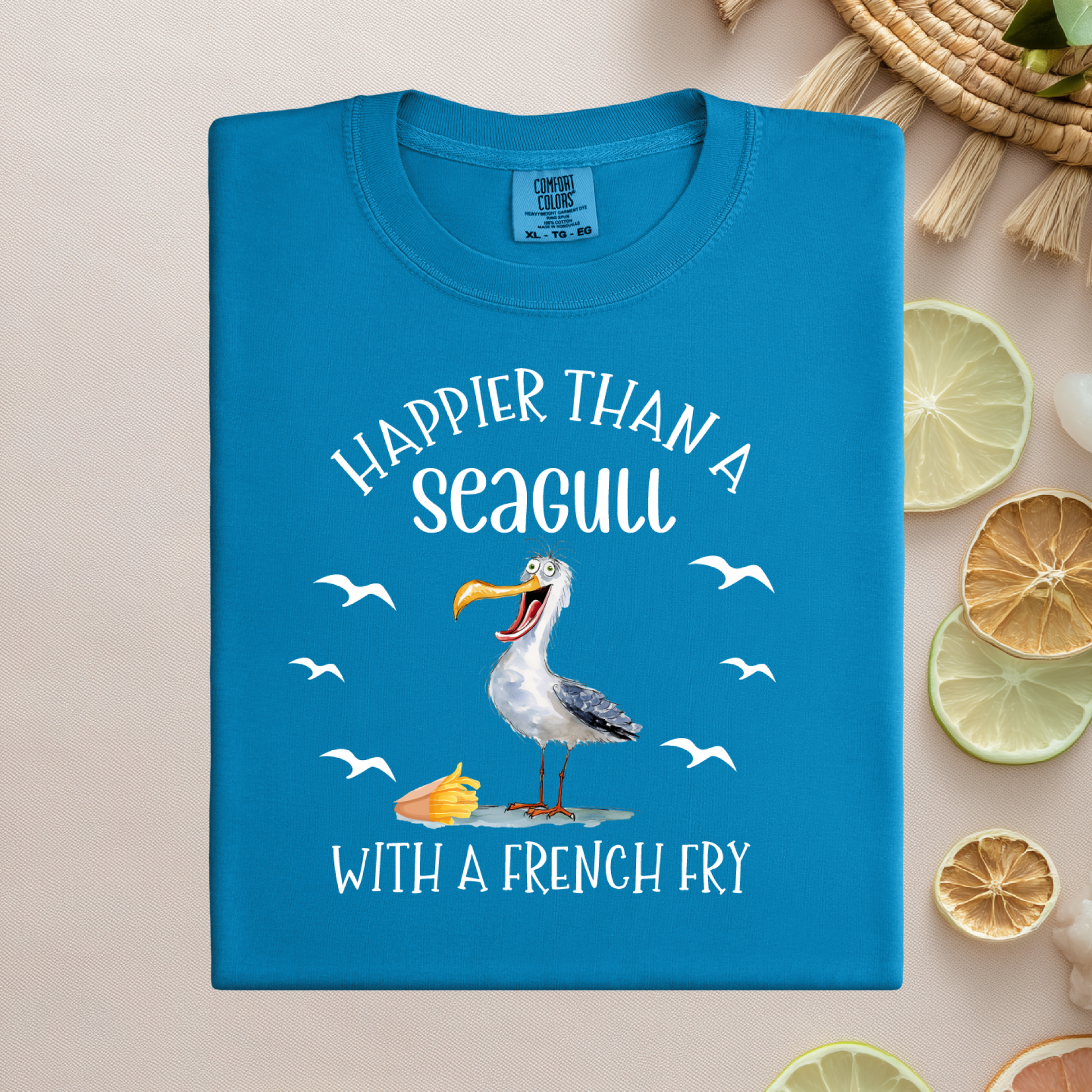 Blue t-shirt with a seagull graphic and text on a beige background