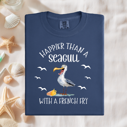 Navy blue t-shirt with a seagull graphic and text on a sandy background