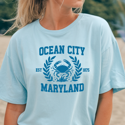 Light blue t-shirt with 'Ocean City, Maryland' design featuring a crab and laurel leaves.