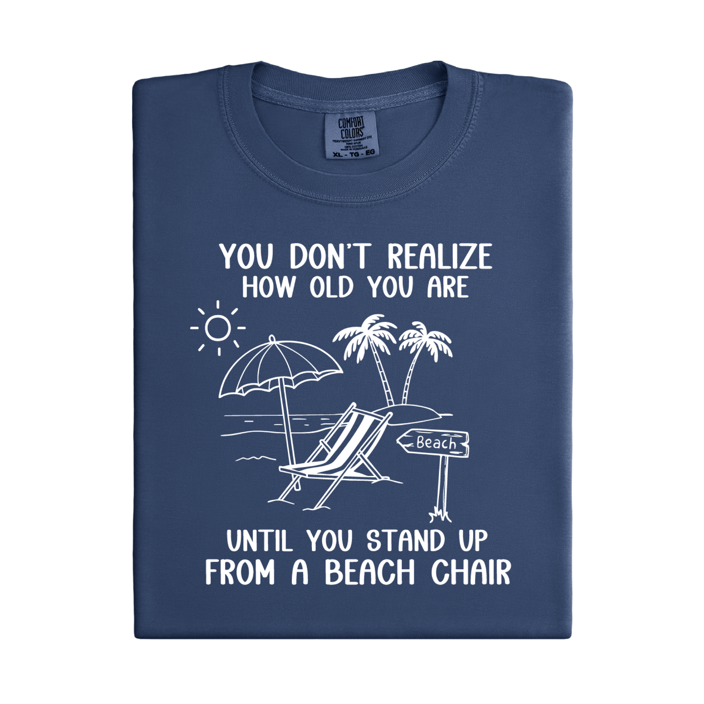 Folded navy blue t-shirt with beach-themed graphic and text on a white background