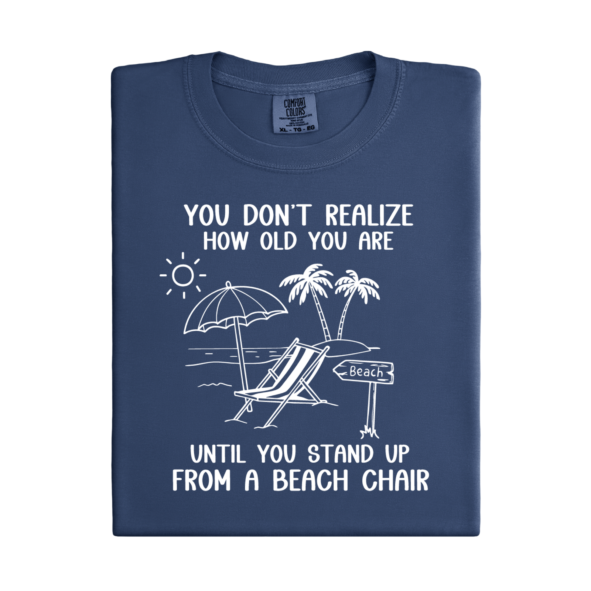 Folded navy blue t-shirt with beach-themed graphic and text on a white background