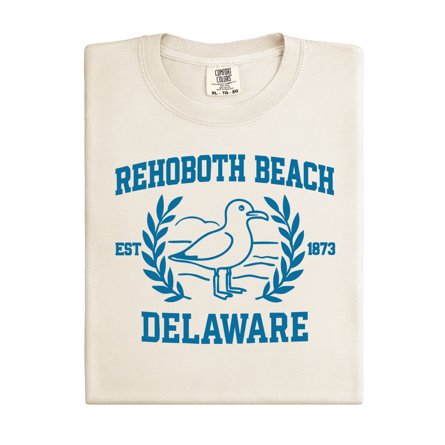 Ivory t-shirt with blue Rehoboth Beach Delaware design on a white background