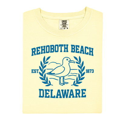 Yellow t-shirt with blue 'Rehoboth Beach, Delaware' design featuring a seagull.