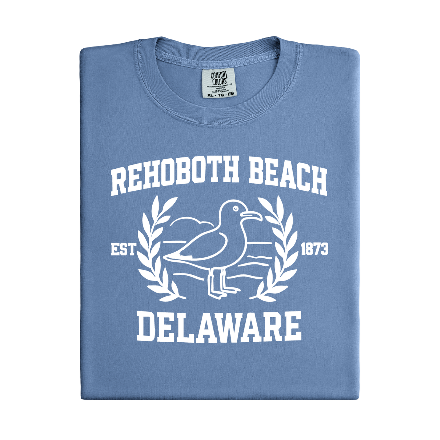 Folded blue t-shirt with white graphic and text 'Rehoboth Beach, Delaware' on a white background