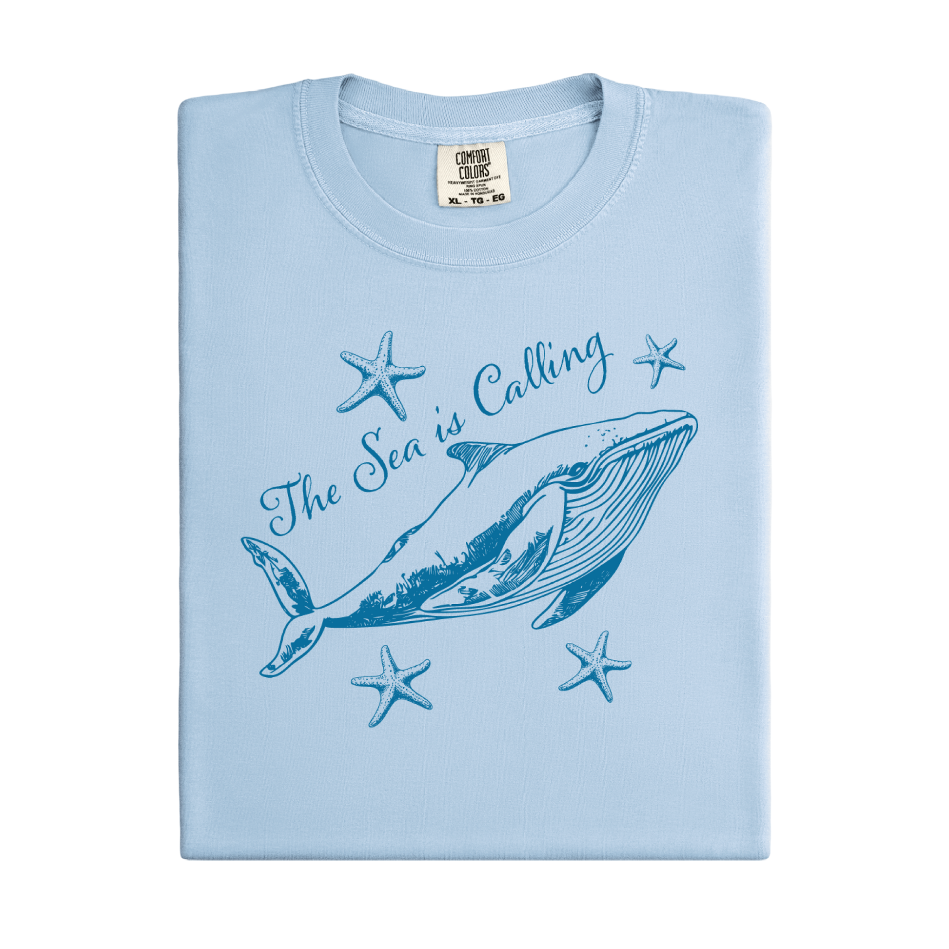 Comfort Colors t-shirt featuring a blue whale illustration surrounded by starfish and the handwritten-style text “The Sea is Calling.” The detailed marine artwork creates a calming coastal aesthetic. This unisex garment-dyed tee offers a soft vintage feel and relaxed fit, perfect for ocean lovers, beach trips, and anyone who enjoys sea-themed graphic shirts with a coastal vibe.