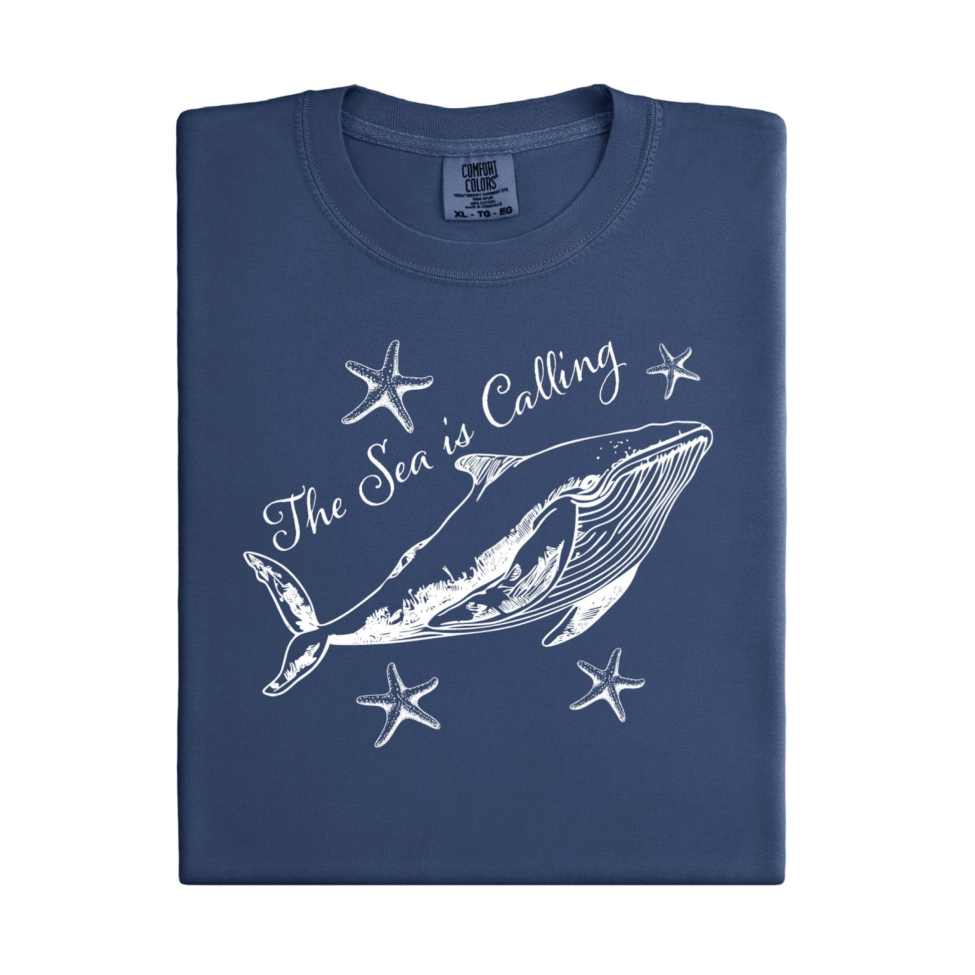 Comfort Colors t-shirt featuring a blue whale illustration surrounded by starfish and the handwritten-style text “The Sea is Calling.” The detailed marine artwork creates a calming coastal aesthetic. This unisex garment-dyed tee offers a soft vintage feel and relaxed fit, perfect for ocean lovers, beach trips, and anyone who enjoys sea-themed graphic shirts with a coastal vibe.