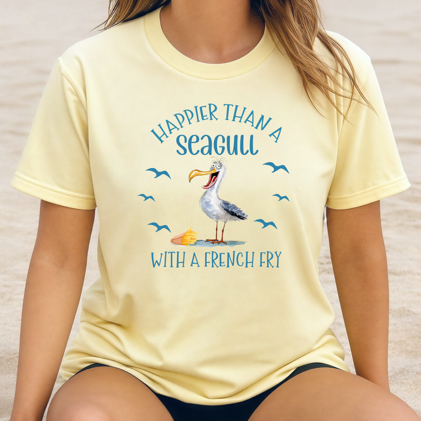 Person wearing a yellow t-shirt with a seagull graphic and text.