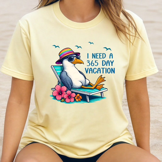 Person wearing a yellow t-shirt with a seagull graphic and text 'I Need a 365 Day Vacation' on a neutral background.