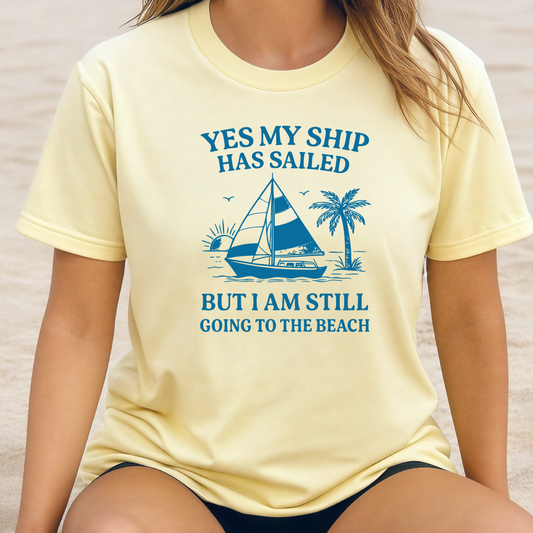 Person wearing a yellow t-shirt with a blue graphic and text on a neutral background