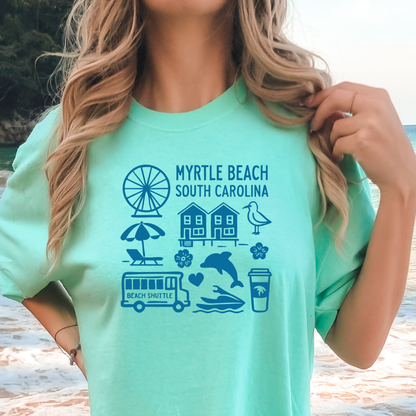 Person wearing a light green t-shirt with 'Myrtle Beach South Carolina' graphics on a beach.