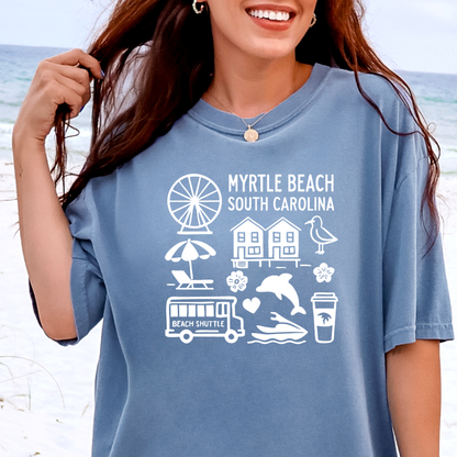 Person wearing a blue t-shirt with 'Myrtle Beach South Carolina' graphics on a beach background