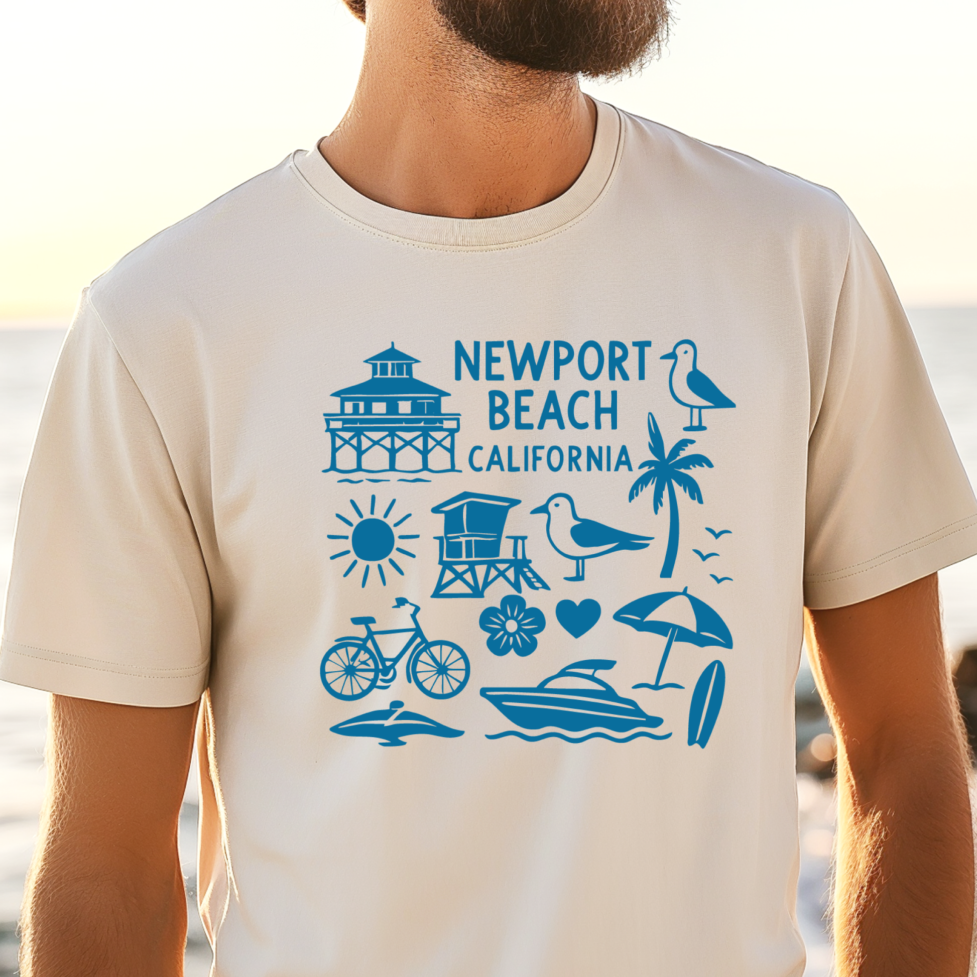 Person wearing a t-shirt with Newport Beach, California graphics on a beach.