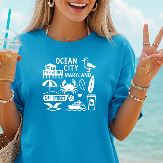 Person wearing a blue t-shirt with 'Ocean City, Maryland' design, holding a drink and making a peace sign.