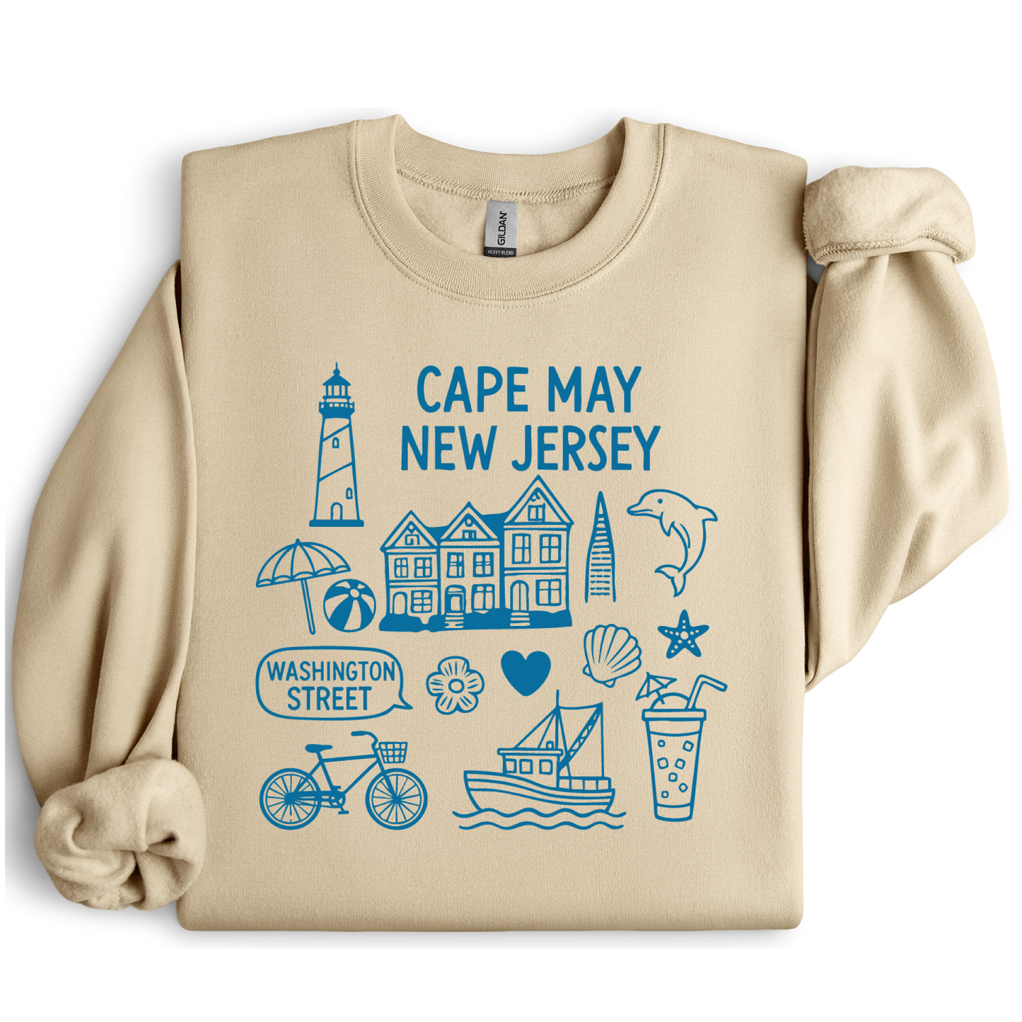 Gildan sweatshirt with blue Cape May New Jersey design featuring beach icons like a lighthouse, dolphin, beach ball, shells, and Washington Street sign. Coastal-inspired pullover made from soft cotton-poly blend fabric, ideal for beach lovers and Cape May fans. Perfect for seaside getaways or relaxing at home, this cozy crewneck celebrates the charm of New Jersey’s iconic coastal town.