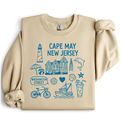 Gildan sweatshirt with blue Cape May New Jersey design featuring beach icons like a lighthouse, dolphin, beach ball, shells, and Washington Street sign. Coastal-inspired pullover made from soft cotton-poly blend fabric, ideal for beach lovers and Cape May fans. Perfect for seaside getaways or relaxing at home, this cozy crewneck celebrates the charm of New Jersey’s iconic coastal town.
