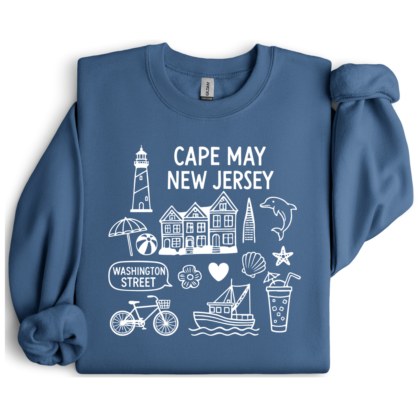 Gildan sweatshirt with blue Cape May New Jersey design featuring beach icons like a lighthouse, dolphin, beach ball, shells, and Washington Street sign. Coastal-inspired pullover made from soft cotton-poly blend fabric, ideal for beach lovers and Cape May fans. Perfect for seaside getaways or relaxing at home, this cozy crewneck celebrates the charm of New Jersey’s iconic coastal town.