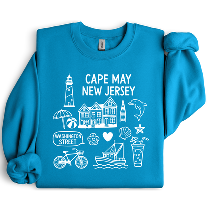 Gildan sweatshirt with blue Cape May New Jersey design featuring beach icons like a lighthouse, dolphin, beach ball, shells, and Washington Street sign. Coastal-inspired pullover made from soft cotton-poly blend fabric, ideal for beach lovers and Cape May fans. Perfect for seaside getaways or relaxing at home, this cozy crewneck celebrates the charm of New Jersey’s iconic coastal town.