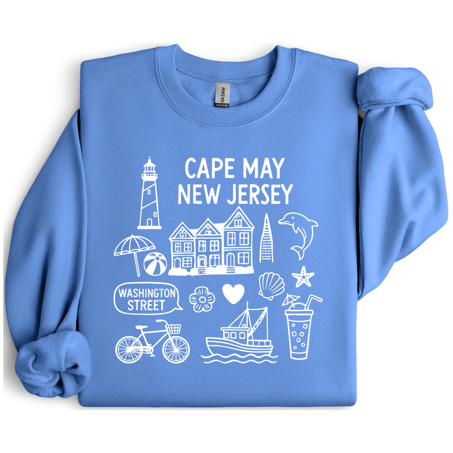Gildan sweatshirt with blue Cape May New Jersey design featuring beach icons like a lighthouse, dolphin, beach ball, shells, and Washington Street sign. Coastal-inspired pullover made from soft cotton-poly blend fabric, ideal for beach lovers and Cape May fans. Perfect for seaside getaways or relaxing at home, this cozy crewneck celebrates the charm of New Jersey’s iconic coastal town.