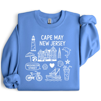 Gildan sweatshirt with blue Cape May New Jersey design featuring beach icons like a lighthouse, dolphin, beach ball, shells, and Washington Street sign. Coastal-inspired pullover made from soft cotton-poly blend fabric, ideal for beach lovers and Cape May fans. Perfect for seaside getaways or relaxing at home, this cozy crewneck celebrates the charm of New Jersey’s iconic coastal town.