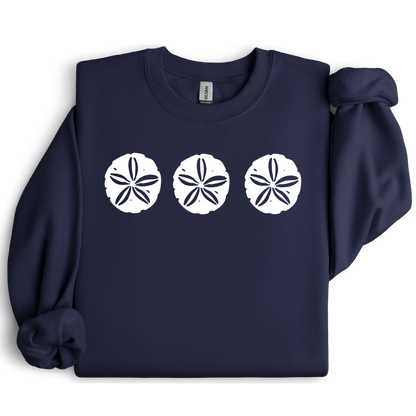Gildan sweatshirt featuring three blue sand dollar graphics printed across the chest. Soft cotton-poly blend fabric with ribbed cuffs and waistband for a cozy, durable fit. Perfect for beach lovers and coastal style enthusiasts who appreciate simple ocean-inspired designs. Ideal for layering on cool seaside evenings or adding a subtle beach vibe to casual outfits.