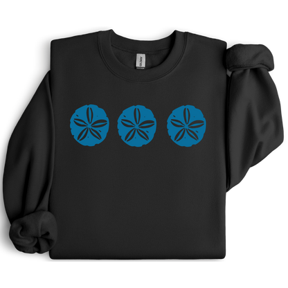 Gildan sweatshirt featuring three blue sand dollar graphics printed across the chest. Soft cotton-poly blend fabric with ribbed cuffs and waistband for a cozy, durable fit. Perfect for beach lovers and coastal style enthusiasts who appreciate simple ocean-inspired designs. Ideal for layering on cool seaside evenings or adding a subtle beach vibe to casual outfits.