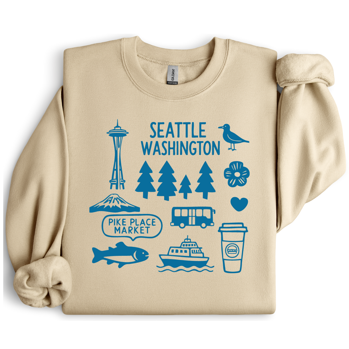 Beige sweatshirt with blue Seattle-themed graphics on a white background
