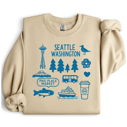 Beige sweatshirt with blue Seattle-themed graphics on a white background