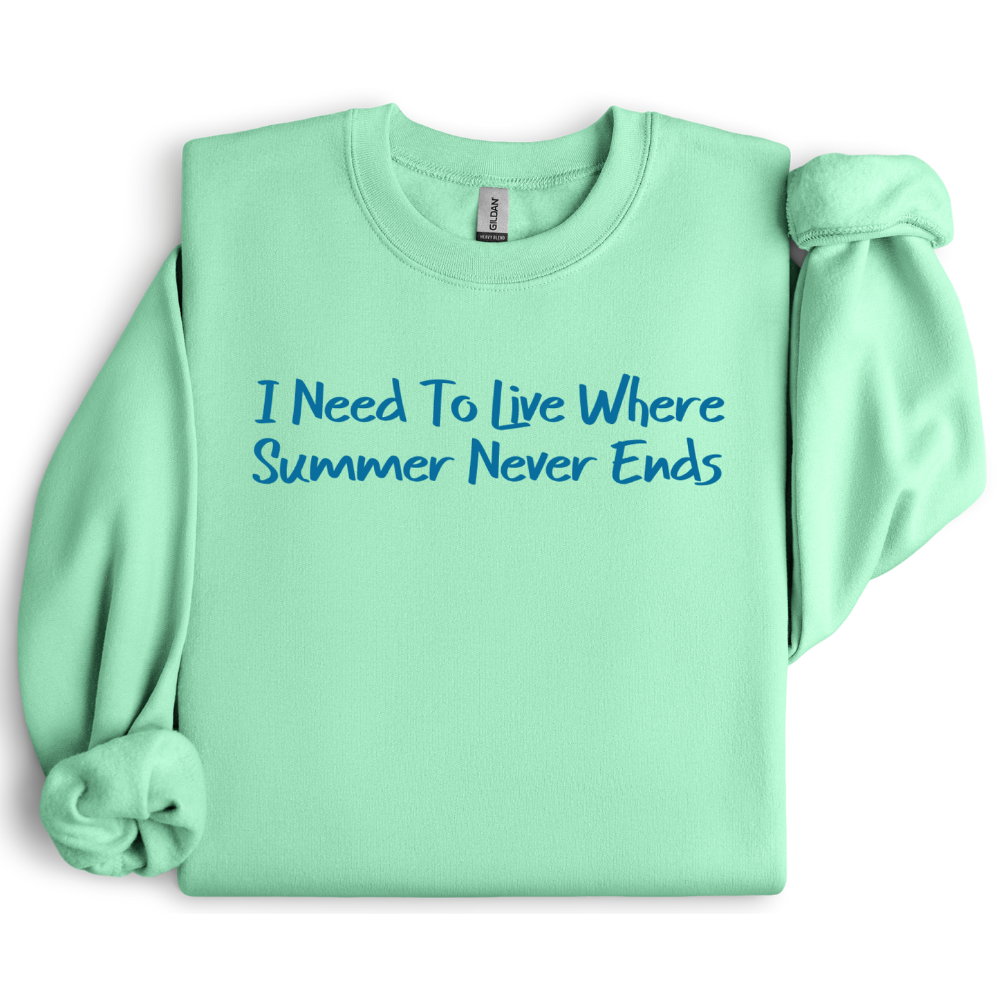 Gildan sweatshirt featuring blue text that reads “I Need To Live Where Summer Never Ends.” Cozy beach-inspired pullover for those who love the sun and ocean lifestyle. Made with a soft cotton-poly blend, ribbed cuffs, and double-needle stitching for durability. Perfect for coastal adventures, vacations, or casual summer-style outfits. Ideal gift for beach lovers and anyone who wishes for endless summer days.