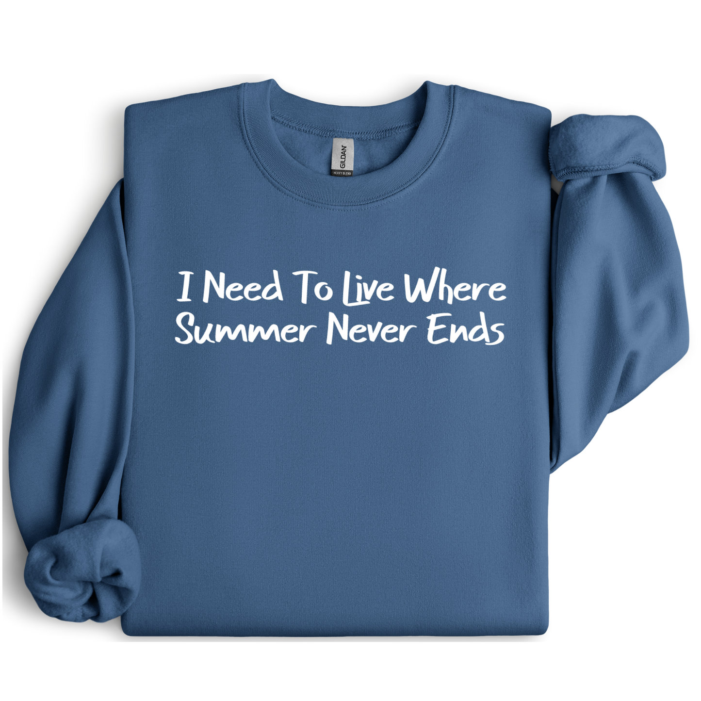 Gildan sweatshirt featuring blue text that reads “I Need To Live Where Summer Never Ends.” Cozy beach-inspired pullover for those who love the sun and ocean lifestyle. Made with a soft cotton-poly blend, ribbed cuffs, and double-needle stitching for durability. Perfect for coastal adventures, vacations, or casual summer-style outfits. Ideal gift for beach lovers and anyone who wishes for endless summer days.