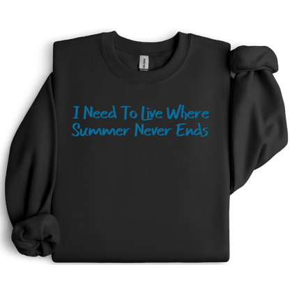 Gildan sweatshirt featuring blue text that reads “I Need To Live Where Summer Never Ends.” Cozy beach-inspired pullover for those who love the sun and ocean lifestyle. Made with a soft cotton-poly blend, ribbed cuffs, and double-needle stitching for durability. Perfect for coastal adventures, vacations, or casual summer-style outfits. Ideal gift for beach lovers and anyone who wishes for endless summer days.