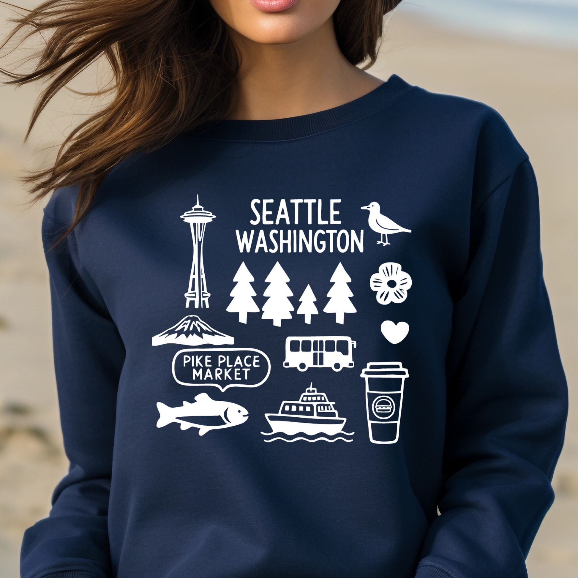 Navy blue sweatshirt with white graphics and text on a beach background