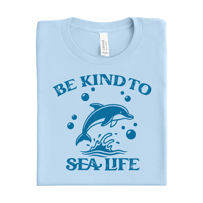 baby blue t-shirt with a dolphin graphic and 'Be Kind to Sea Life' text on a white background
