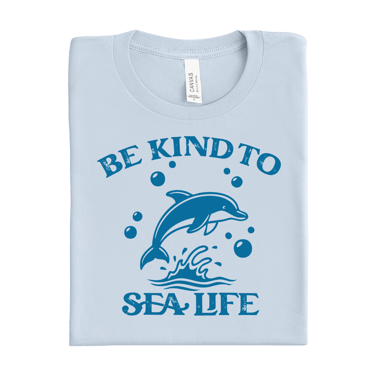 Light blue t-shirt with a dolphin graphic and 'Be Kind to Sea Life' text on a white background