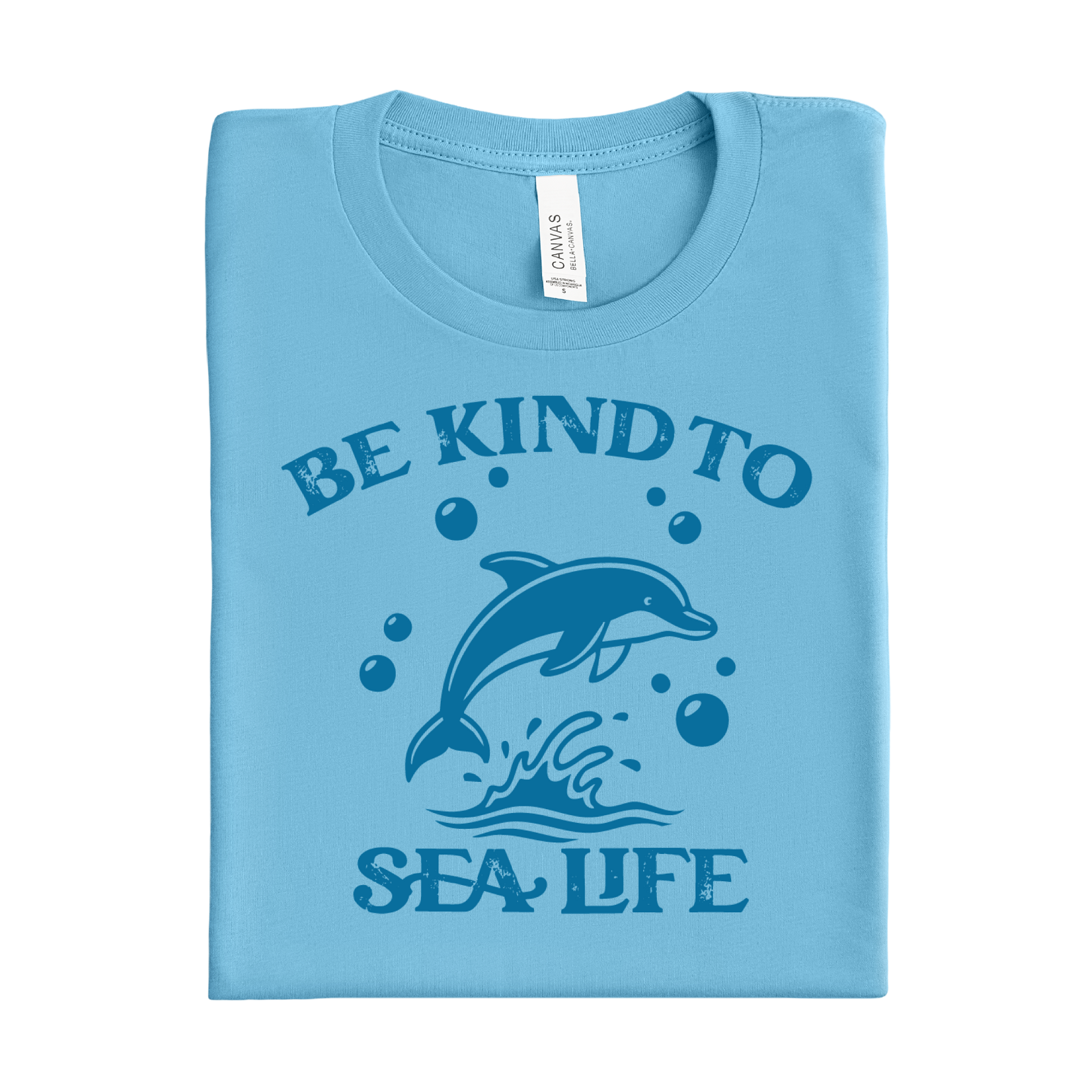Folded ocean blue t-shirt with a dolphin graphic and text on a white background