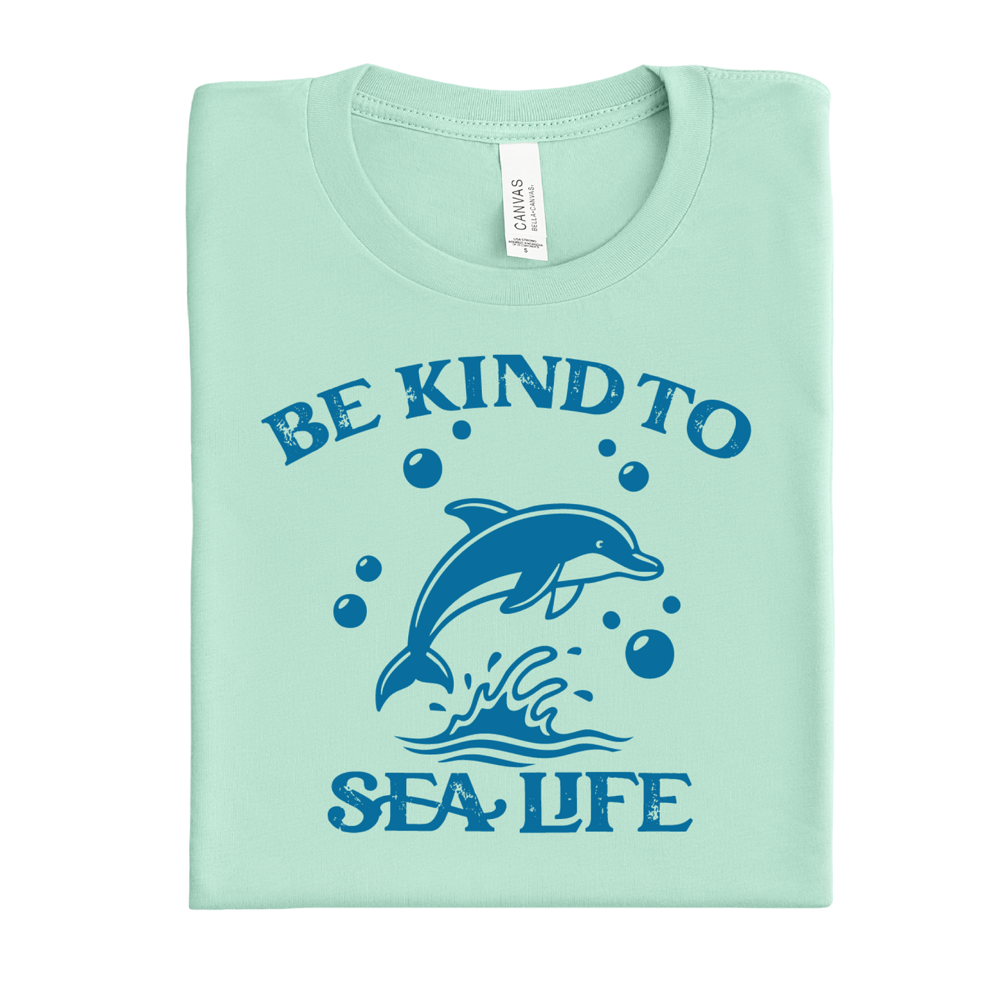 mint green t-shirt with a dolphin graphic and text 'Be Kind to Sea Life' on a white background