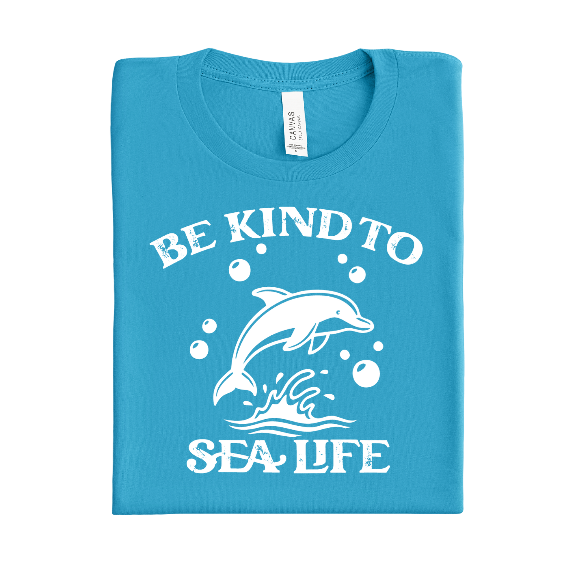 Folded aqua blue t-shirt with white dolphin graphic and text 'Be Kind to Sea Life' on a white background