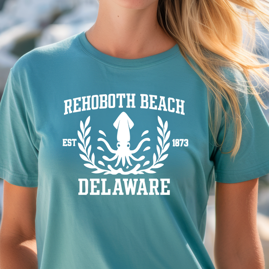 Person wearing a turquoise t-shirt with Rehoboth Beach Delaware design.