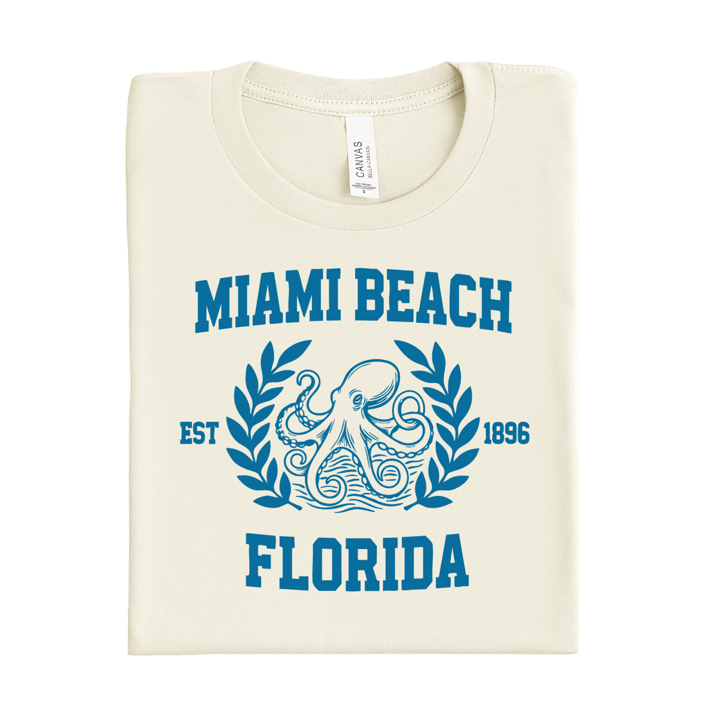 Folded t-shirt with 'Miami Beach, Florida' design on a white background