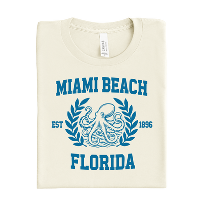 Folded t-shirt with 'Miami Beach, Florida' design on a white background