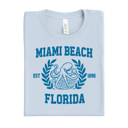 Light blue t-shirt with 'Miami Beach Florida' design featuring an octopus and laurel leaves.