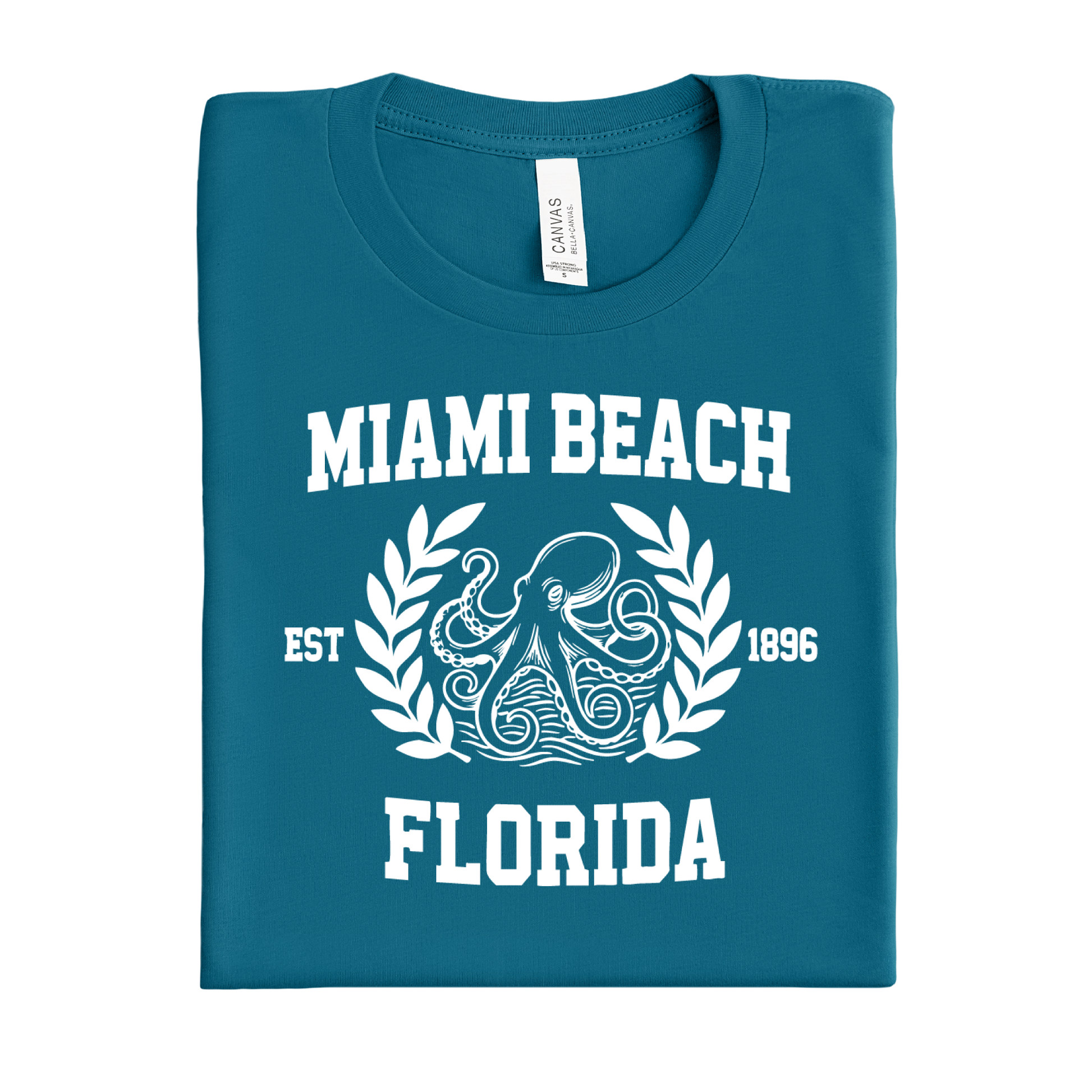 Folded deep teal t-shirt with 'Miami Beach, Florida' text and octopus design on a white background