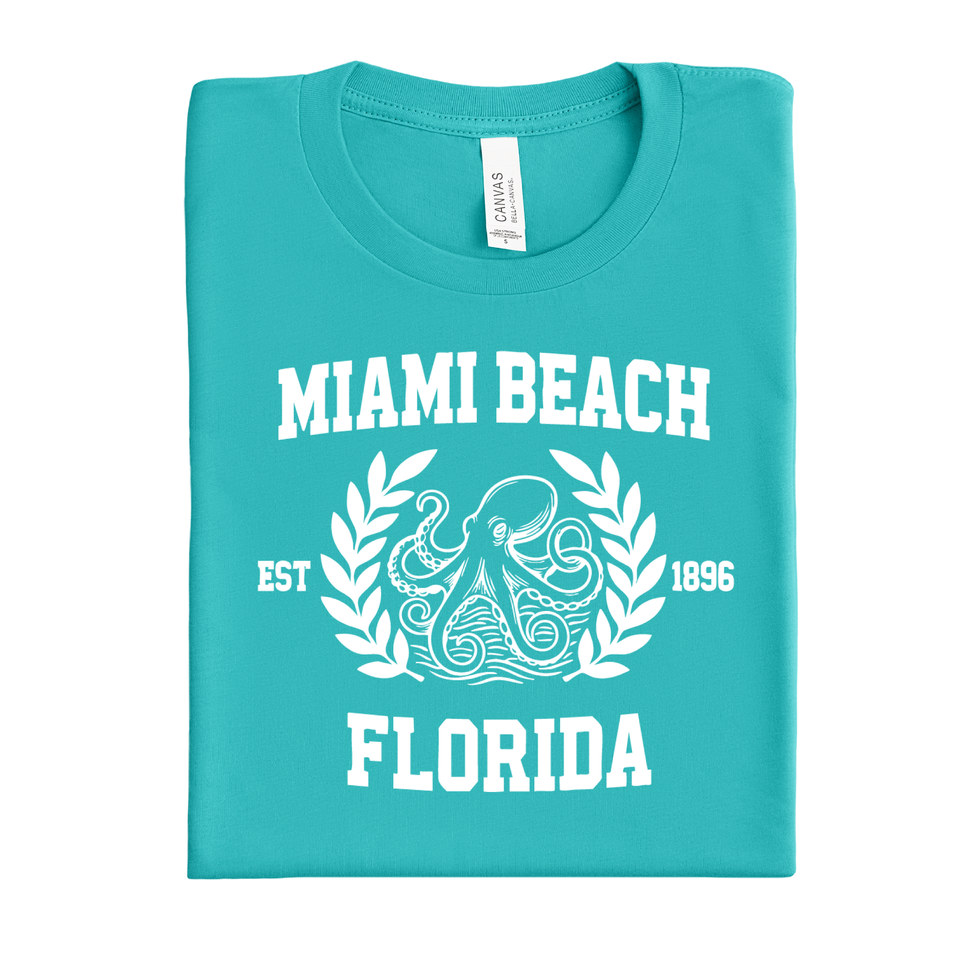 Folded teal t-shirt with 'Miami Beach, Florida' text and octopus design on a white background