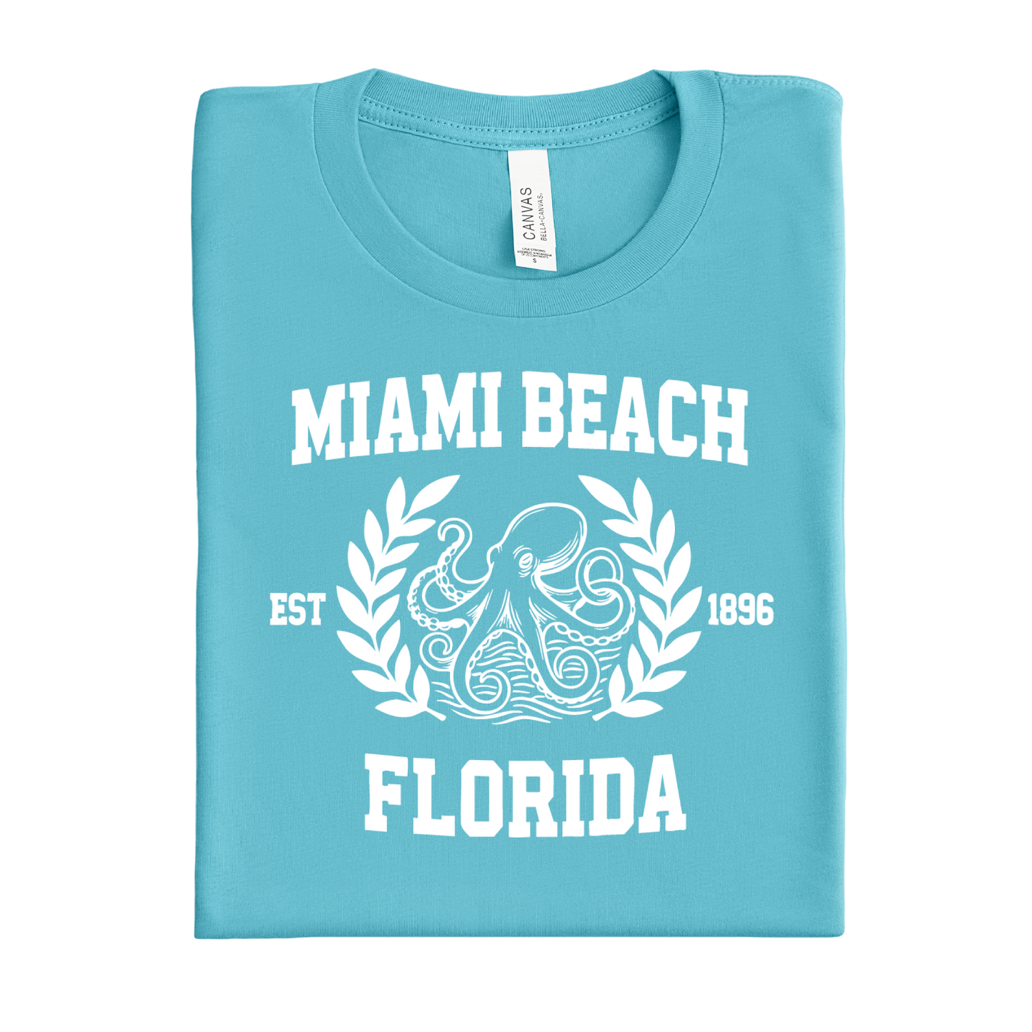 Folded turquoise  t-shirt with 'Miami Beach, Florida' text and octopus design on a white background